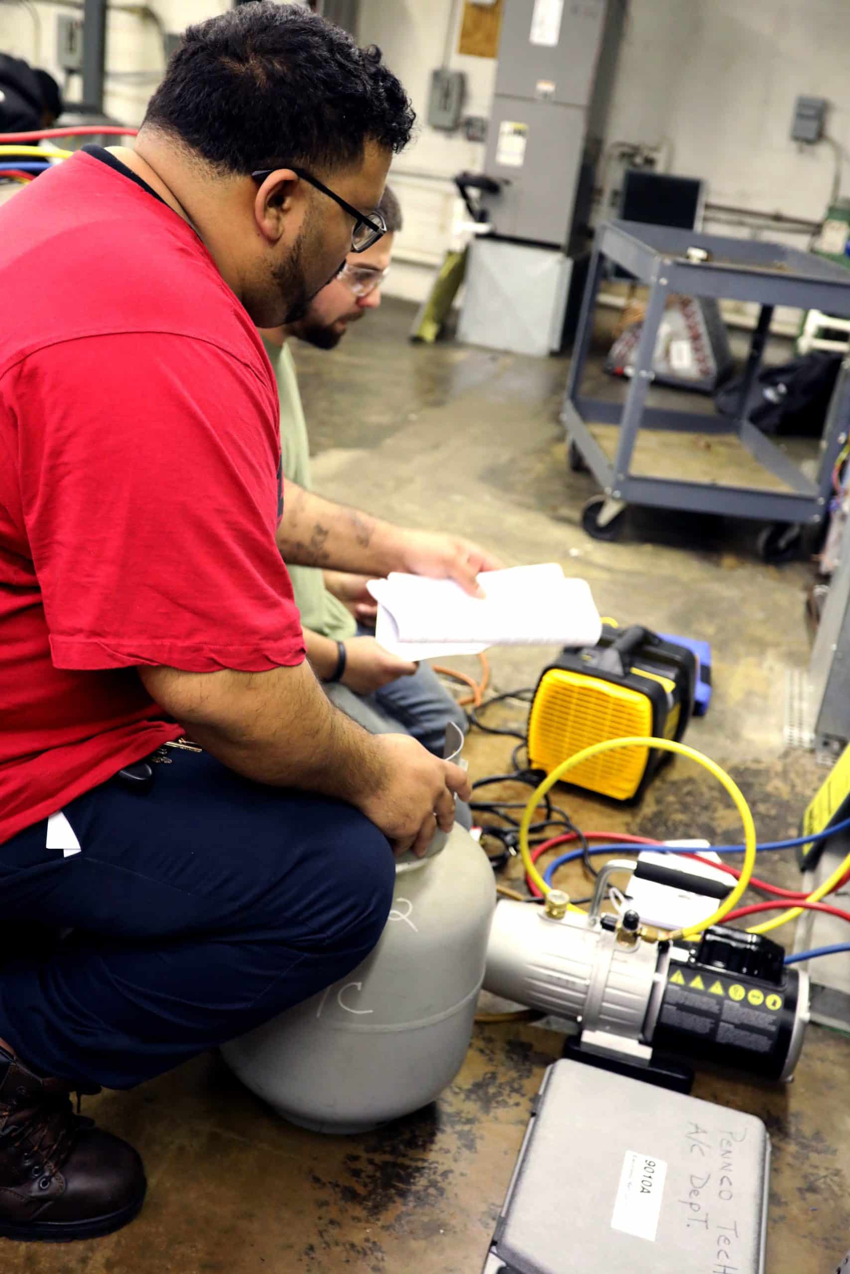 Vocational Students Examining Heating Components