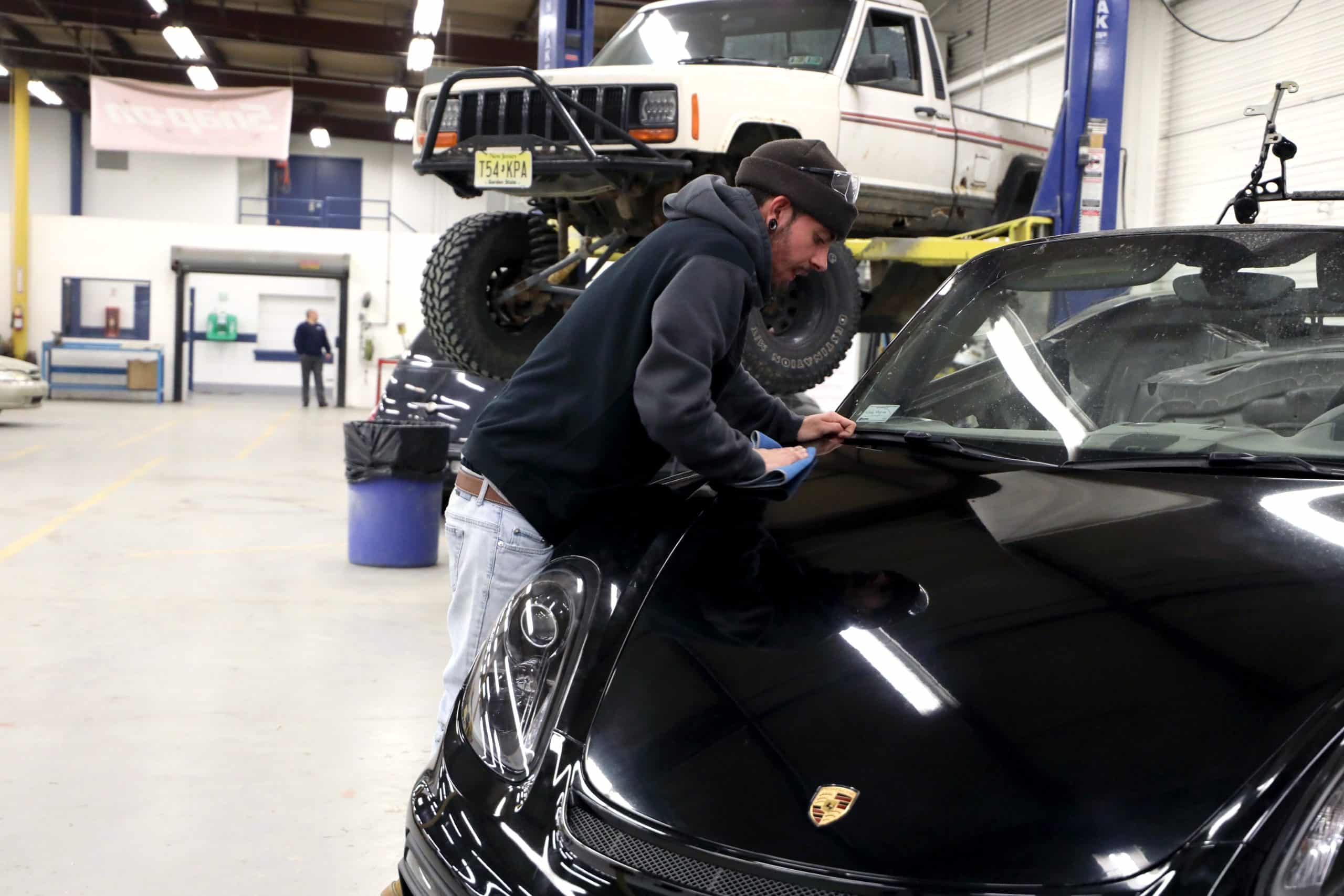 Auto body tech working on car