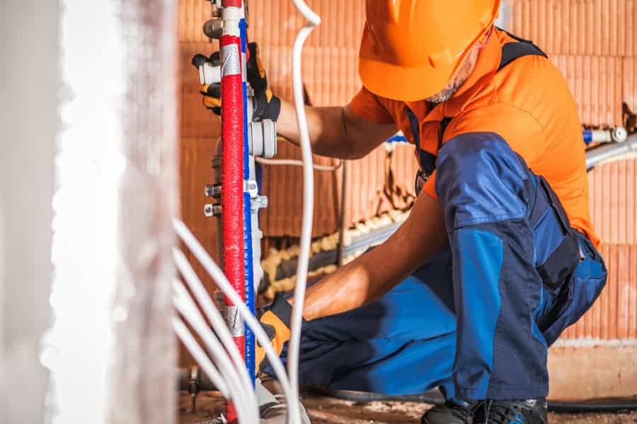 Plumbing installing bathroom water supply components 