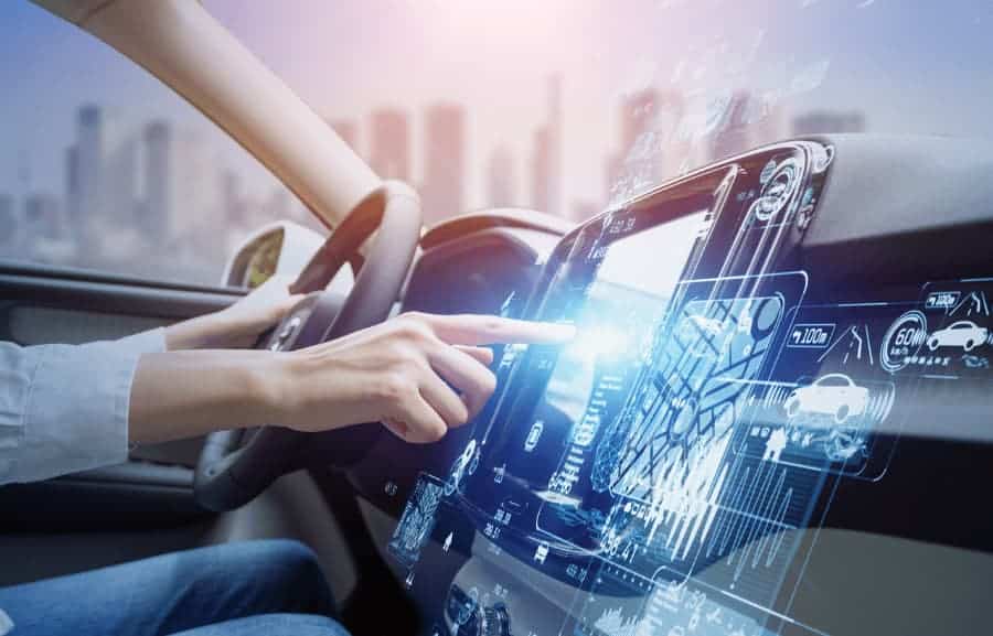 driver pressing button on futuristic dashboard interface in car