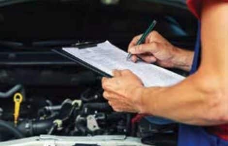 Auto mechanic marking off checklist