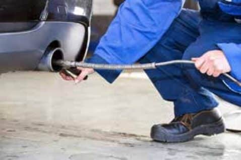 Mechanic checking emissions