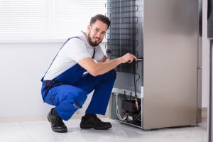 Refrigeration technician at work