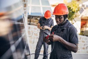 Solar installer connects solar photovoltaic panel