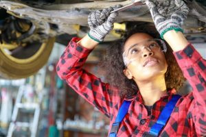 Automotive technician student working on a vehicle