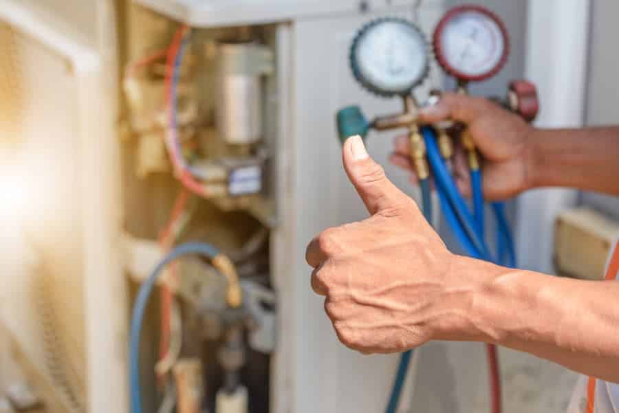 HVAC technician gives thumbs up
