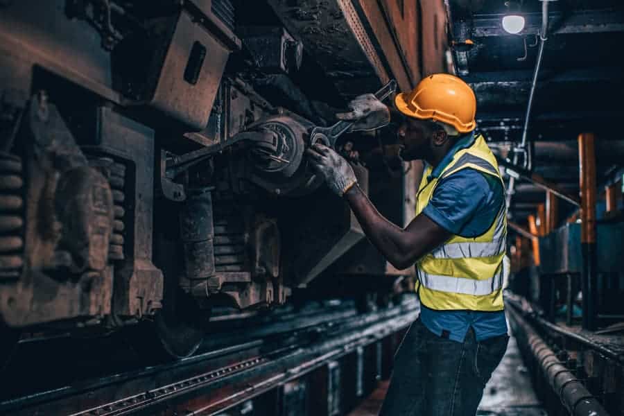 Diesel mechanic works on train
