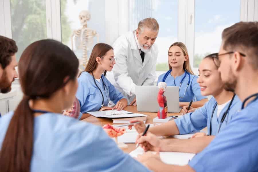 Doctor works with medical assistant students
